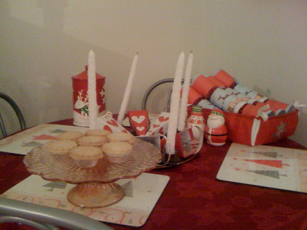 I have a big red Christmas table cloth an Advent ring as my centre piece 